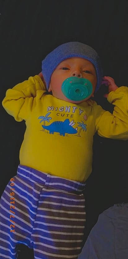 Amir is registered to the contest to win money with this photo: baby, baby_products, baby_toddler_clothing, baseball_cap, beanie, cap, child, electric_blue, font, happy, headgear, hood, hoodie, knit_cap, pattern, person, personal_protective_equipment, sleeve, t_shirt, toddler