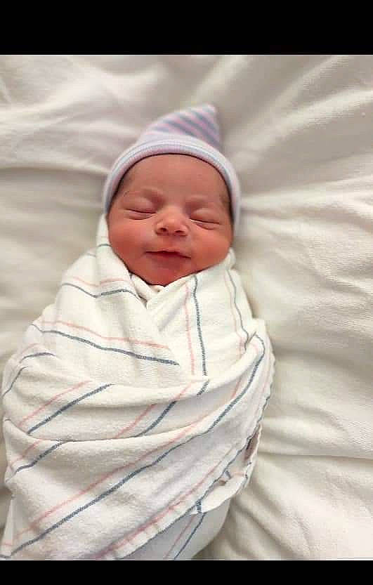 Amir joined the competition — help win amazing prizes! baby, baby_sleeping, baby_toddler_clothing, bedtime, child, comfort, event, face, happy, headwear, linens, peach, person, portrait_photography, sleeve, smile, thumb, toddler