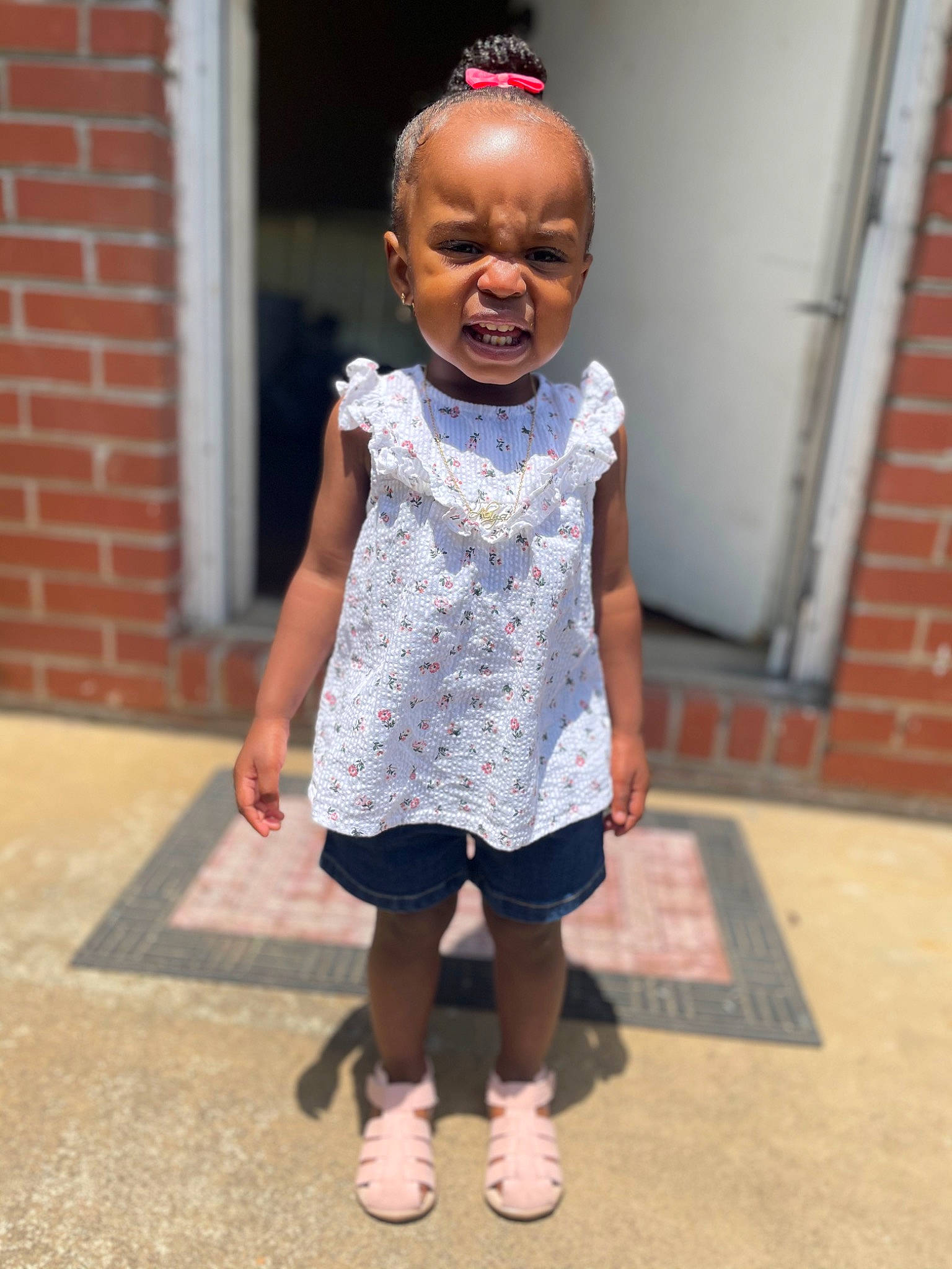 Alaysia is registered to the contest to win money with this photo: baby_toddler_clothing, brick, brickwork, child, chin, fashion_design, flooring, fun, happy, human_leg, magenta, pattern, person, pink, sandal, shorts, sleeve, t_shirt, toddler, vacation