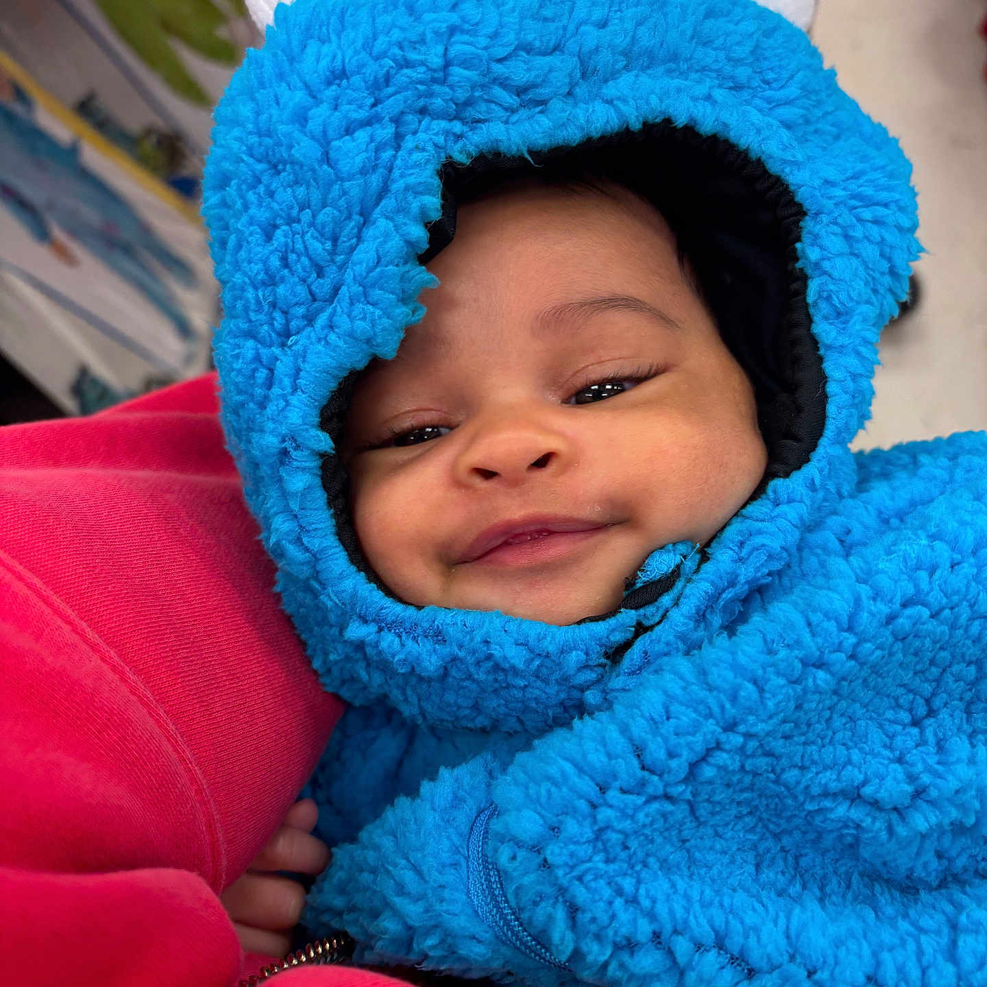 Nova is registered to the contest to win money with this photo: baby, bodypart, bonnet, cap, clothing, coat, doll, face, hat, head, hood, hoodie, jacket, knitwear, person, photography, portrait, sweater, sweatshirt, toy