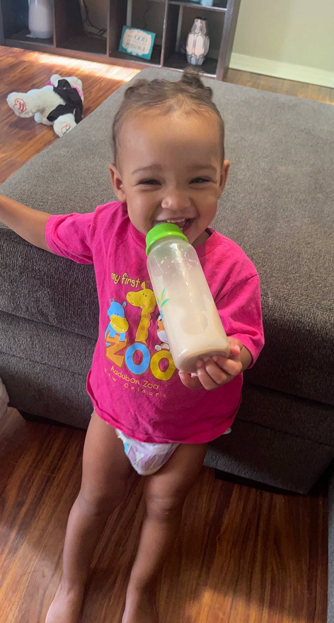 Kapri is registered to the contest to win money with this photo: baby, baby_bottle, baby_toddler_clothing, bottle, cheek, child, drinkware, finger, happy, head, joint, mouth, person, pink, plastic_bottle, shoulder, skin, smile, thumb, toddler