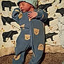 Kingston is registered to the contest to win money with this photo: baby, newborn, sleeping, onesie, hat, blanket, bear_prints, carpet, infant, child, cozy, soft, sleep, pattern, cute, indoors, resting, toddler, clothing, portrait
