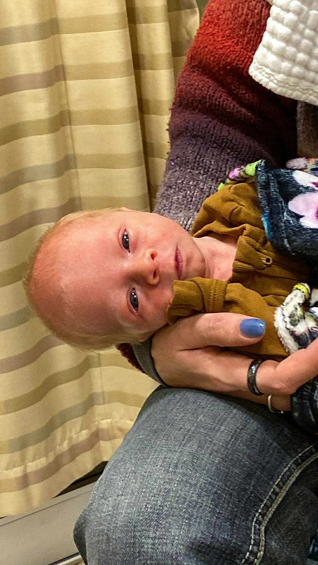 Kingston joined the competition — help win amazing prizes! baby, infant, person, hand, clothing, blanket, knit_sweater, jeans, curtain, indoor, holding, face, skin, newborn, cozy, striped, multicolored, portrait, resting, closeup