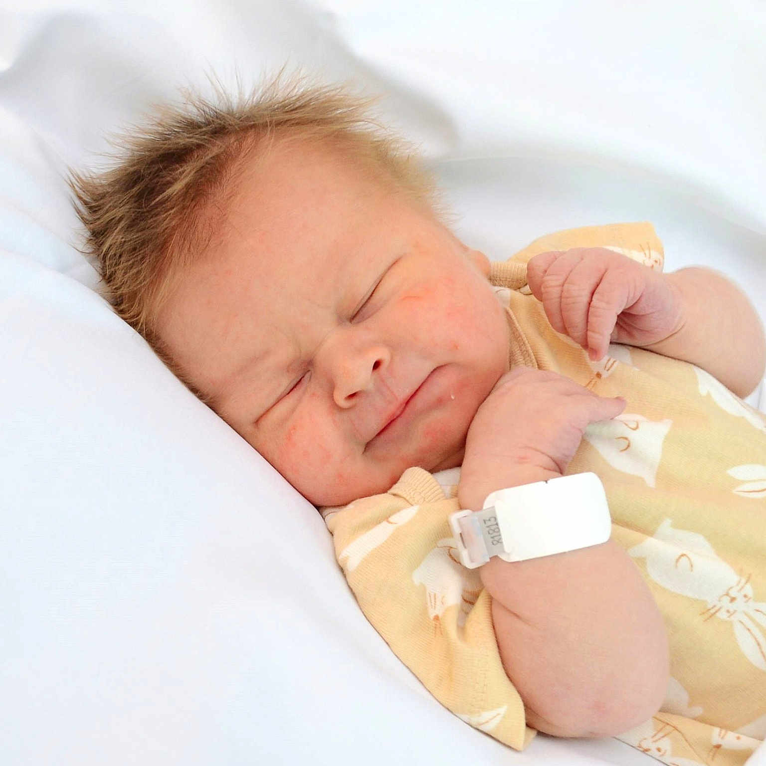 Simon joined the competition — help win amazing prizes! newborn, baby, sleeping, infant, blanket, onesie, yellow_clothing, hospital_wristband, cute, peaceful, toddler, portrait, soft, indoor, child, face, hand, skin, hair, resting