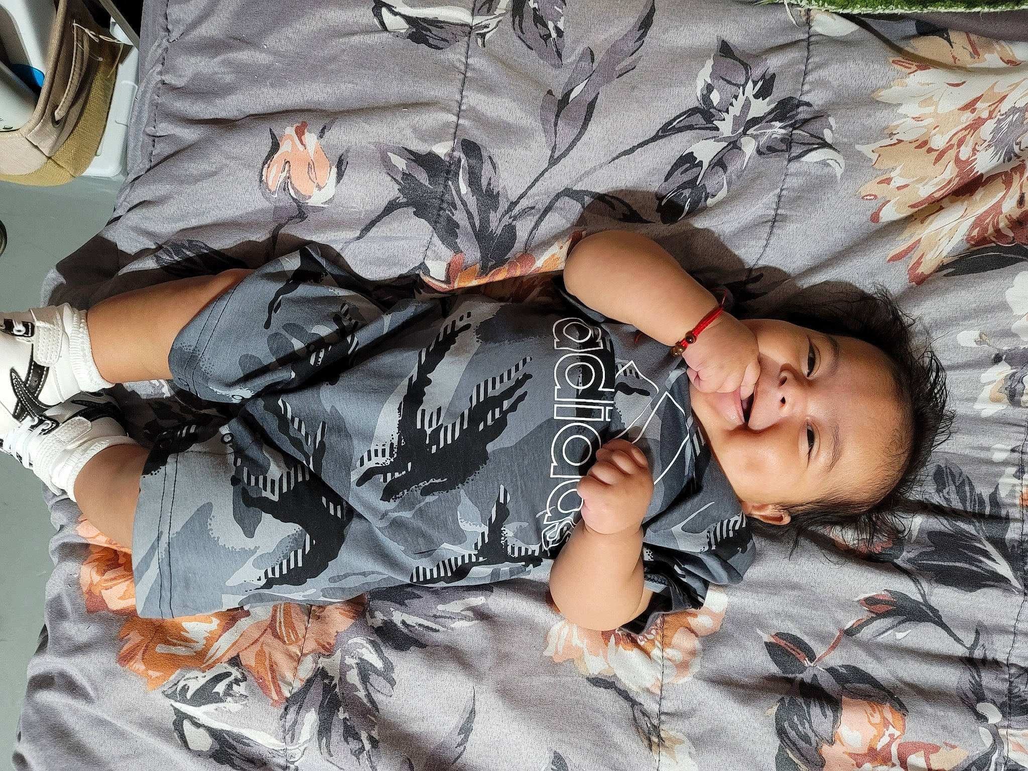 Nathaniel joined the competition — help win amazing prizes! black_hair, comfort, cool, fashion_accessory, hat, joy, pattern, person, personal_protective_equipment, sitting, sleeve, smile, sportswear, t_shirt, textile, thigh, tree, uniform