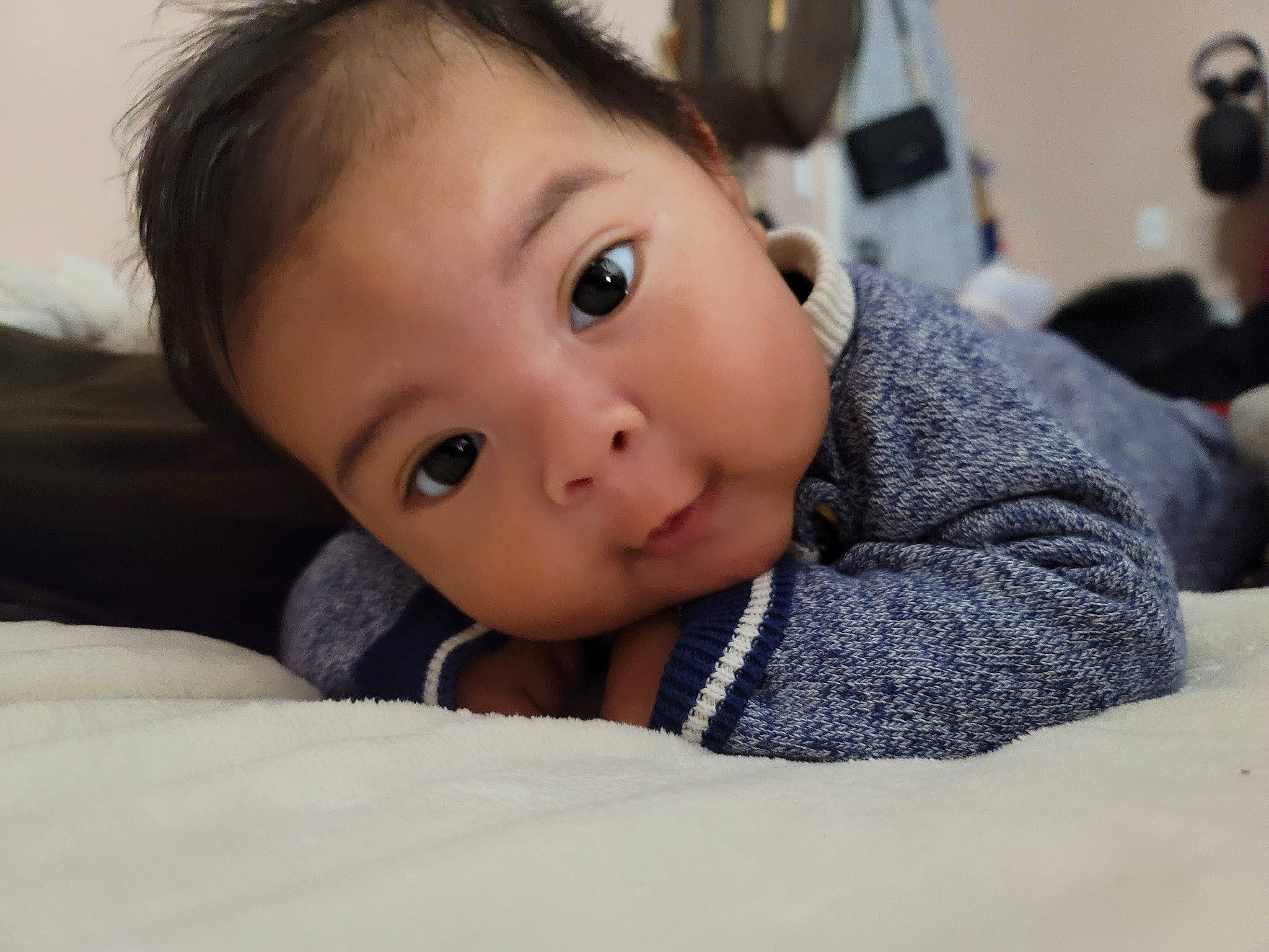 Nathaniel is registered to the contest to win money with this photo: baby, cheek, child, chin, close_up, comfort, eyebrow, eyelash, flooring, fur, happy, iris, lip, mouth, no_expression, nose, person, skin, sleeve, toddler