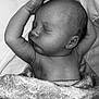 Parker is registered to the contest to win money with this photo: newborn, baby, sleeping, blanket, arm, face, head, skin, monochrome, black_and_white, peaceful, infant, closeup, soft_texture, rest, portrait, bed, cozy, quiet, human