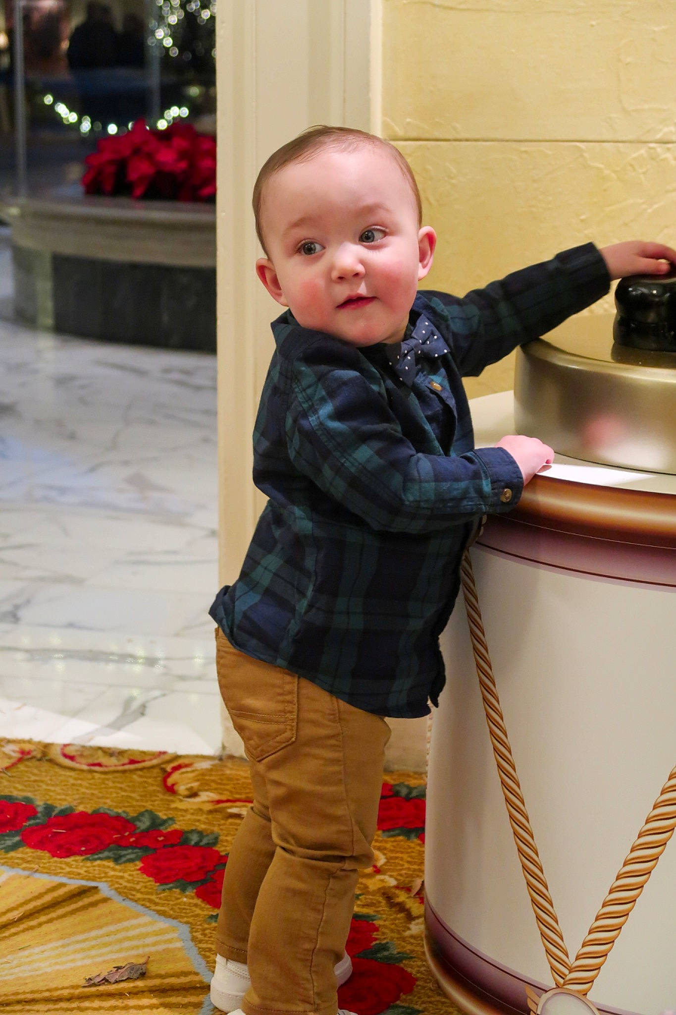 Oliver is registered to the contest to win money with this photo: baby, baby_toddler_clothing, cheek, child, event, floor, flooring, fun, happy, human_body, leisure, pattern, person, room, sitting, skin, sleeve, standing, toddler, vacation
