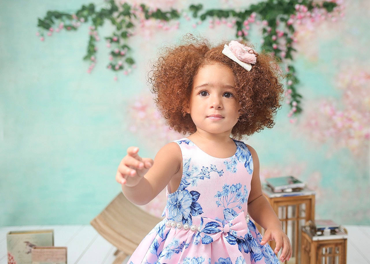 Flor is registered to the contest to win money with this photo: baby_toddler_clothing, child, day_dress, dress, facial_expression, fashion_design, flash_photography, fun, hair, hairstyle, happy, iris, leisure, person, pink, room, skin, smile, summer, textile