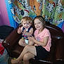 children, smiling, couch, indoor, curtain, cartoon, dalmatian, happy, sibling, young_child, toddler, clothing, barefoot, carpet, playful, family, portrait, brown_couch, colorful, curtains
