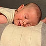 Liam participe au concours pour gagner de l'argent avec cette photo : baby, sleeping, pillow, smile, face, infant, rest, peaceful, cozy, soft, child, closeup, comfort, cute, skin, head, expression, indoors, relaxation, calm