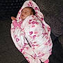 baby, blanket, pink, sleeping, couch, floral, soft, cozy, infant, wrapped, resting, child, face, home, comfort, furniture, apparel, peaceful, relaxed, indoors