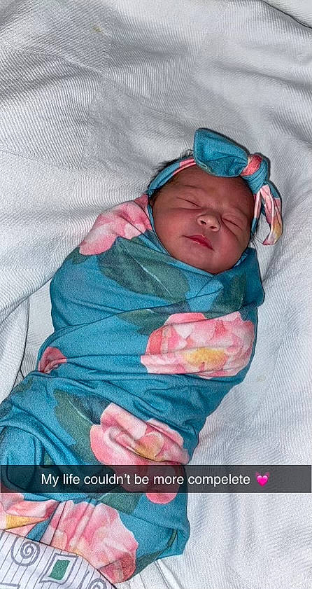 Ailani is registered to the contest to win money with this photo: baby, baby_products, baby_sleeping, baby_toddler_clothing, bedtime, blanket, cheek, child, comfort, headwear, linens, nap, person, pink, sleep, toddler