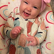 Harleigha joined the competition — help win amazing prizes! baby, infant, smile, headband, pink_bow, onesie, fruit_pattern, blanket, rainbow_pattern, happy, cute, lying_down, child, face, hand, cozy, indoors, soft_texture, apparel, playful