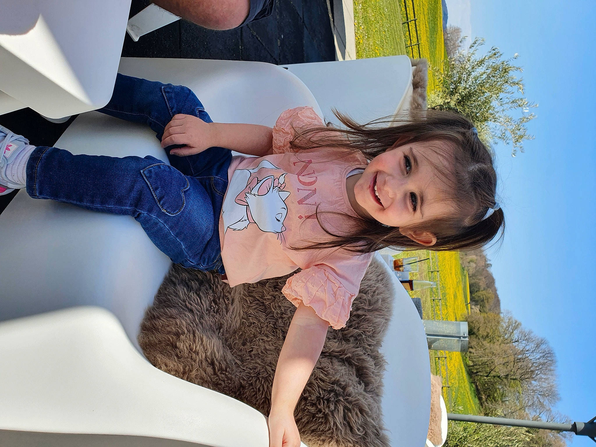 Soraya participe au concours pour gagner de l'argent avec cette photo : black_hair, child, fun, happy, human_leg, jeans, joy, knee, lap, leisure, people_in_nature, person, plant, sitting, sky, smile, summer, thigh, toddler, tree