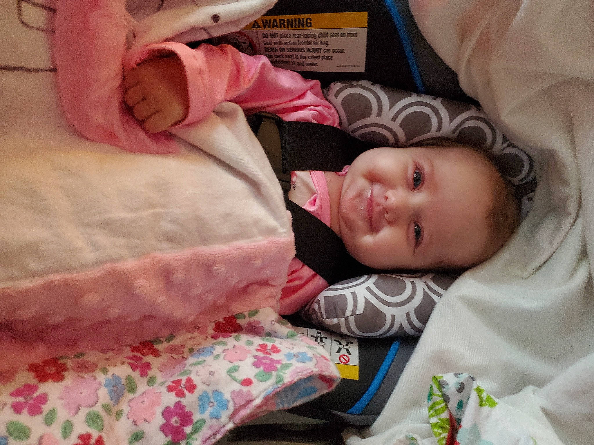 Alyson is registered to the contest to win money with this photo: baby, baby_products, baby_toddler_clothing, bed, bed_sheet, bedding, bedtime, child, comfort, eyelash, happy, joy, linens, nap, pattern, person, pink, room, skin, smile
