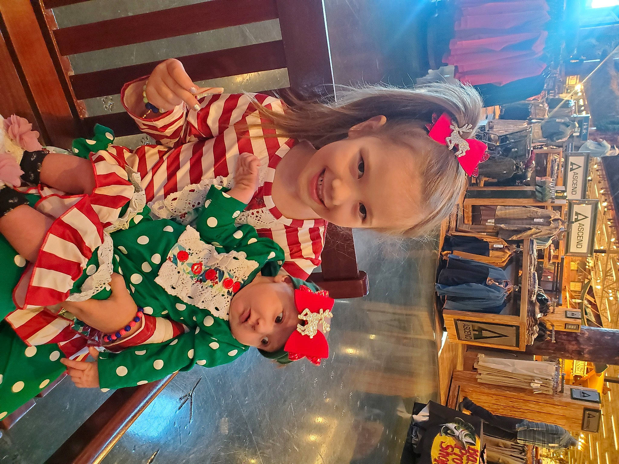 Aaliyah is registered to the contest to win money with this photo: baby_toddler_clothing, carmine, child, christmas, christmas_decoration, christmas_eve, event, fun, happy, hat, headwear, holiday, joy, person, room, sleeve, smile, toddler, tradition