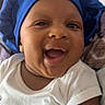 Saage joined the competition — help win amazing prizes! baby, smiling, blue_bonnet, white_onesie, face, infant, happy, child, indoor, portrait, cute, headwear, skin, person, young_child, joyful, closeup, expression, cheerful, baby_clothing
