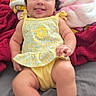 Violet joined the competition — help win amazing prizes! baby, child, smiling, tongue_out, yellow_clothing, blanket, bed, indoor, cute, happy, person, infant, plush_blanket, soft_texture, portrait, playful, young_child, skin, face, arms