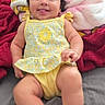 Violet joined the competition — help win amazing prizes! arms, baby, bed, blanket, blue_pattern, child, cute, happy, indoors, infant, legs, person, pink_blanket, playful, red_blanket, sitting, skin, smiling, tongue_out, yellow_outfit