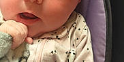 Elena is registered to the contest to win money with this photo: baby, blanket, child, closeup, cushion, cute, expression, eyes, face, hand, head, indoors, infant, newborn, onesie, person, portrait, purple, skin, soft