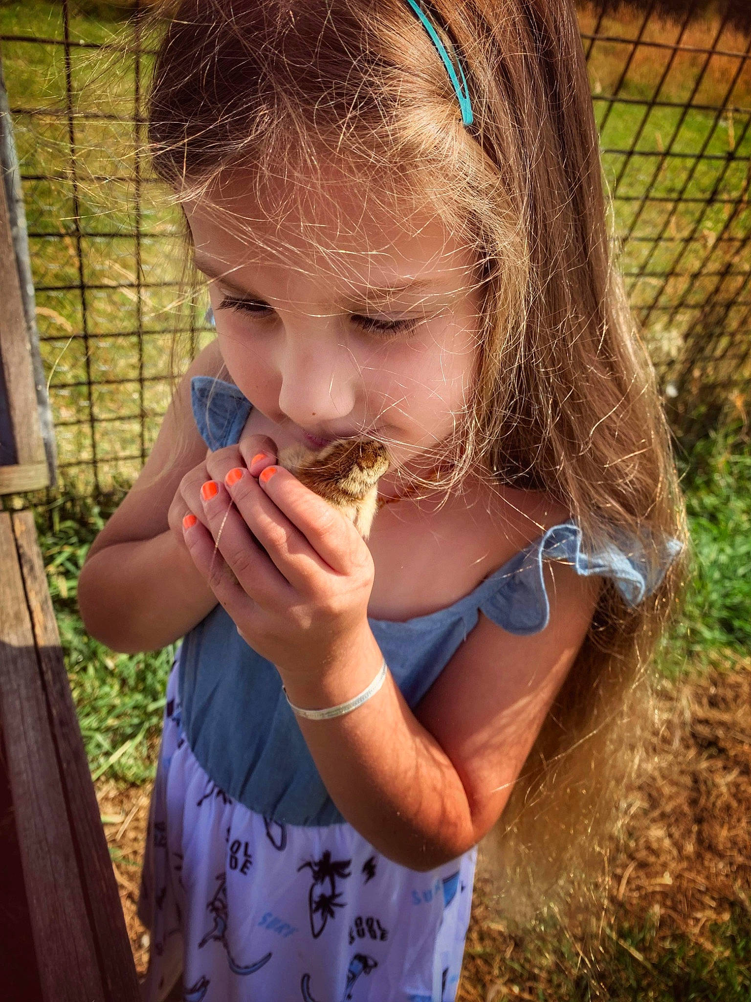 Starla is registered to the contest to win money with this photo: arm, child, eyelash, finger, food, food_craving, fun, gesture, grass, hand, happy, lip, mouth, nose, people_in_nature, person, plant, soil, t_shirt, thumb