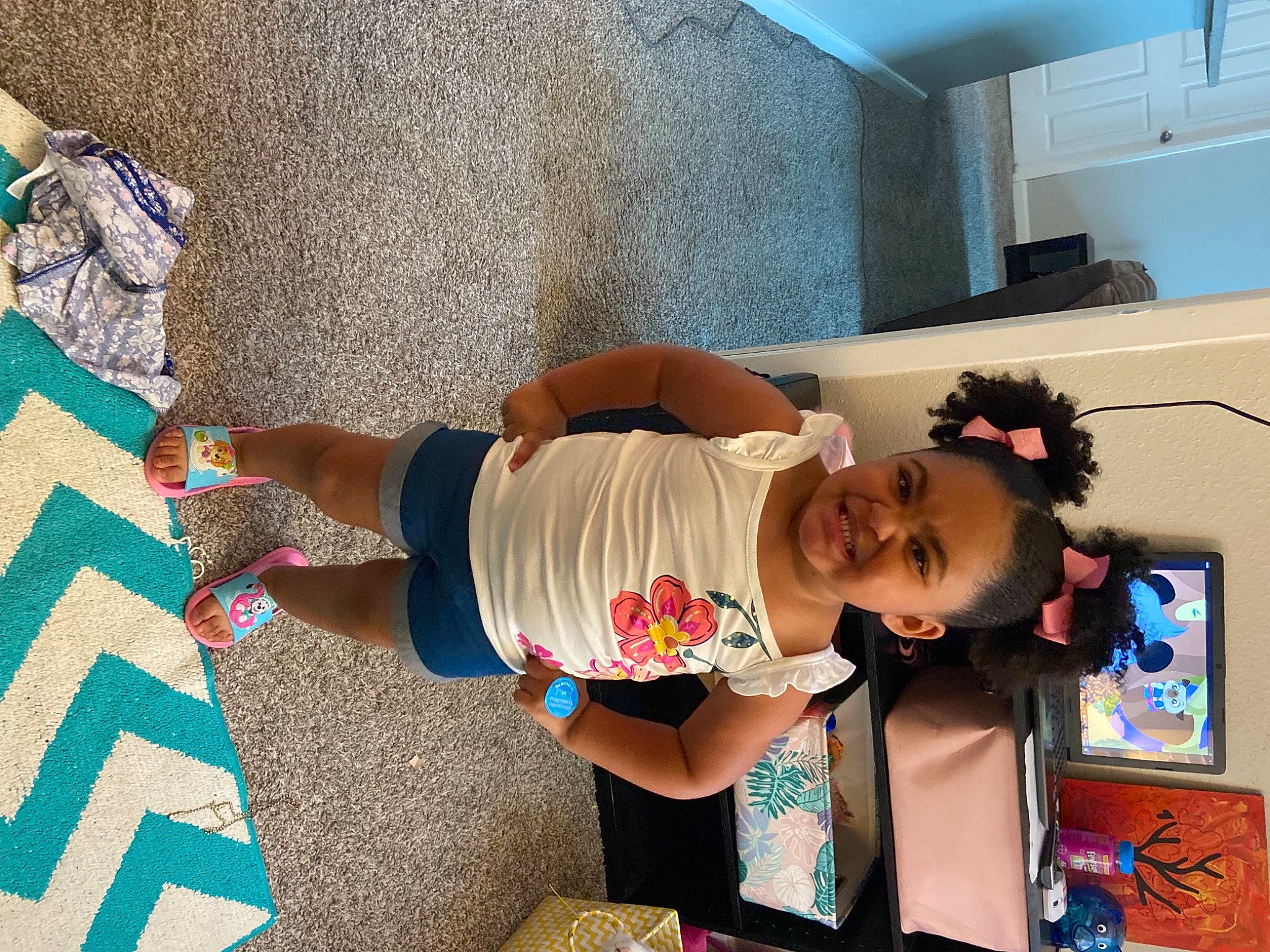 Nevaeh joined the competition — help win amazing prizes! art, blue, child, flooring, fun, happy, home_appliance, human_leg, joy, leisure, person, play, room, sandal, shorts, smile, t_shirt, textile, thigh, toddler