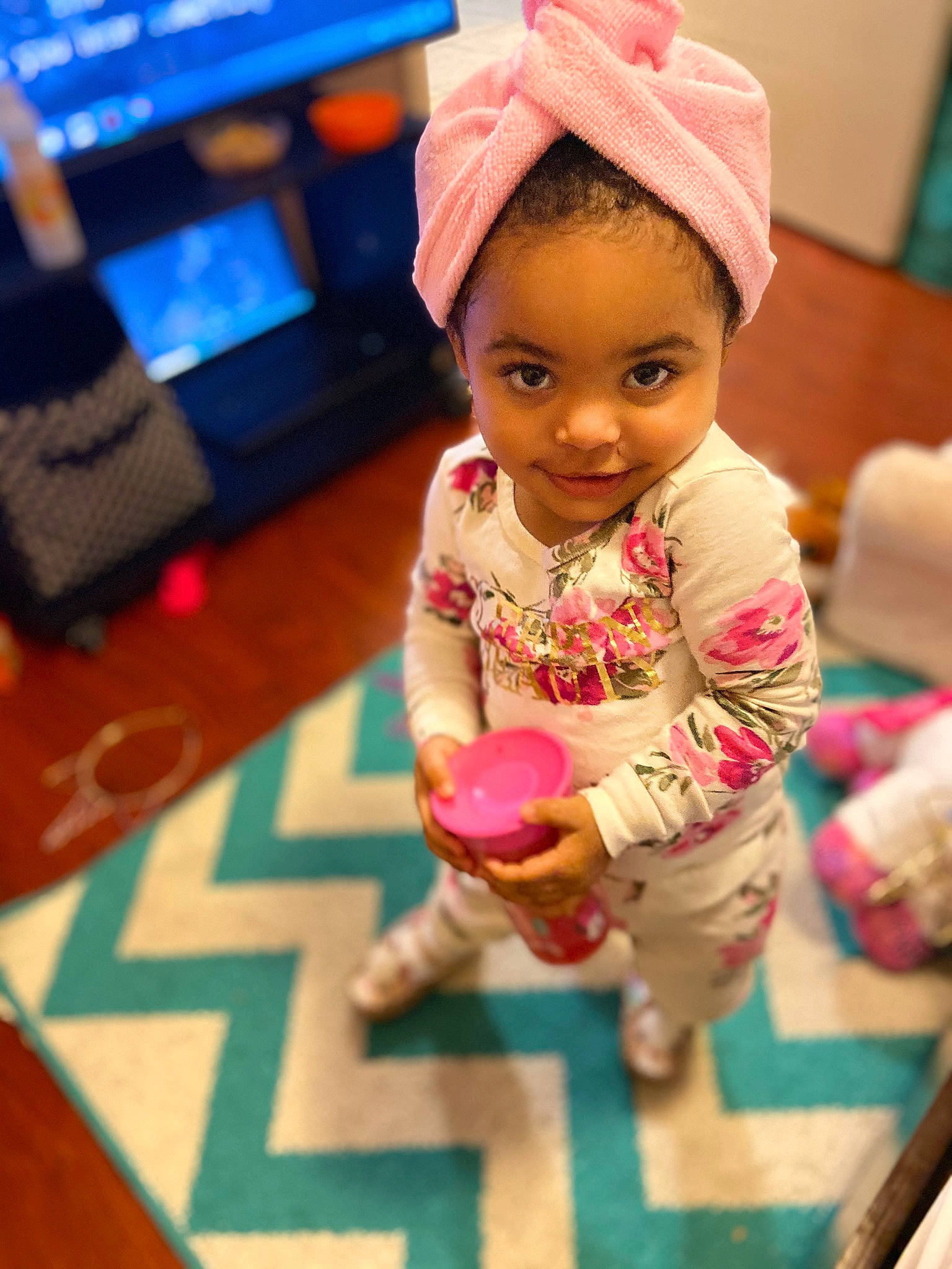 Nevaeh is registered to the contest to win money with this photo: cap, child, doll, finger, floor, flooring, fun, hand, happy, head, human_body, joy, leisure, person, photograph, pink, skin, standing, thumb, toddler