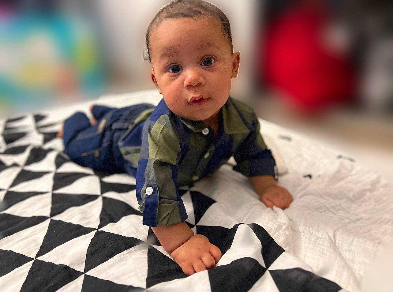 Amari joined the competition — help win amazing prizes! baby, baby_toddler_clothing, black, carmine, child, comfort, flooring, fun, happy, leisure, linens, pattern, person, portrait_photography, room, sitting, sleeve, surprise, toddler, white
