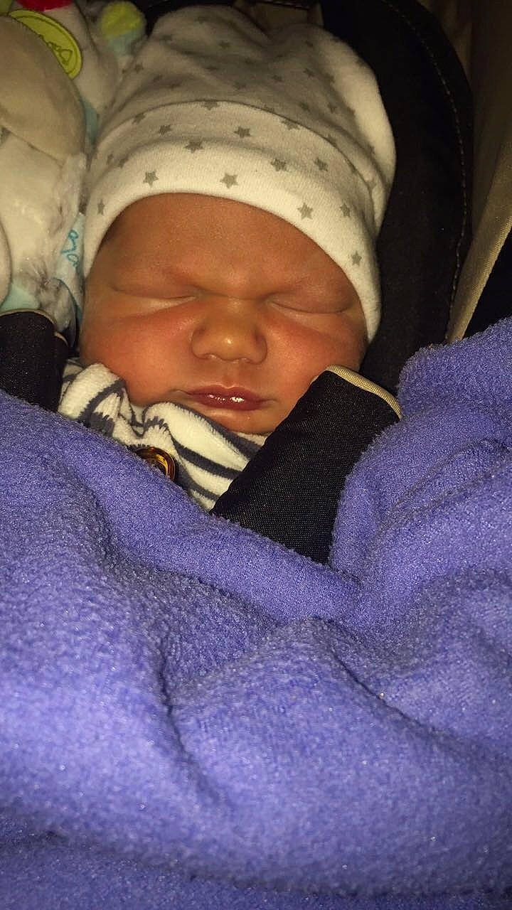 Emylio participe au concours pour gagner de l'argent avec cette photo : baby, bedtime, birth, cheek, child, headwear, nap, person, purple, skin, sleep, smile, toddler