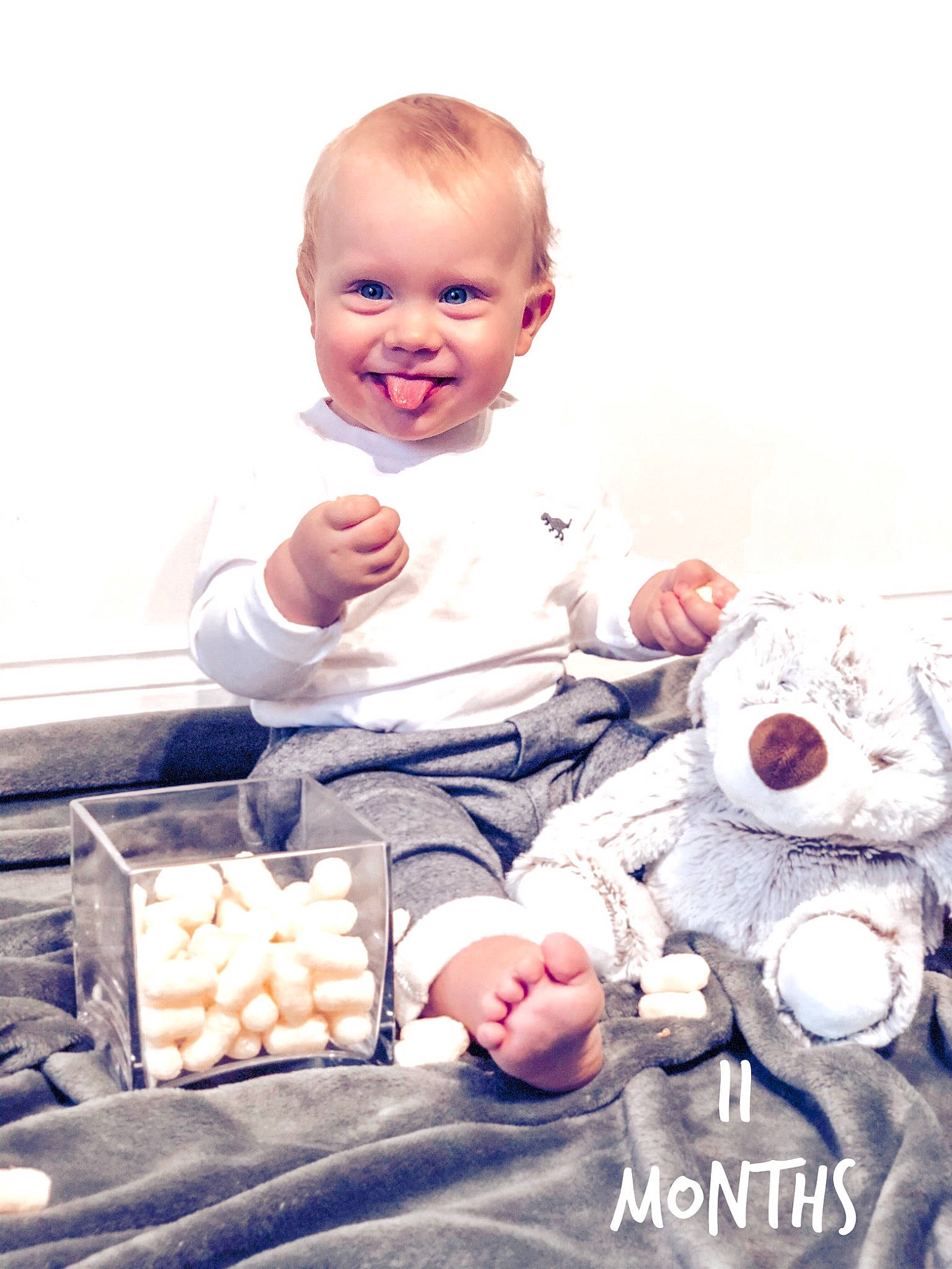 Ben is registered to the contest to win money with this photo: arm, baby, baby_toddler_clothing, cheek, child, comfort, eye, facial_expression, finger, flash_photography, hand, happy, joy, leg, person, skin, sleeve, smile, sock, toddler