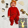 baby, infant, red_onesie, reindeer_hat, christmas_decorations, wooden_ornaments, gold_baubles, white_blanket, smiling, holiday, festive, cute, happy, lying_down, indoors, portrait, seasonal, celebration, child, cozy