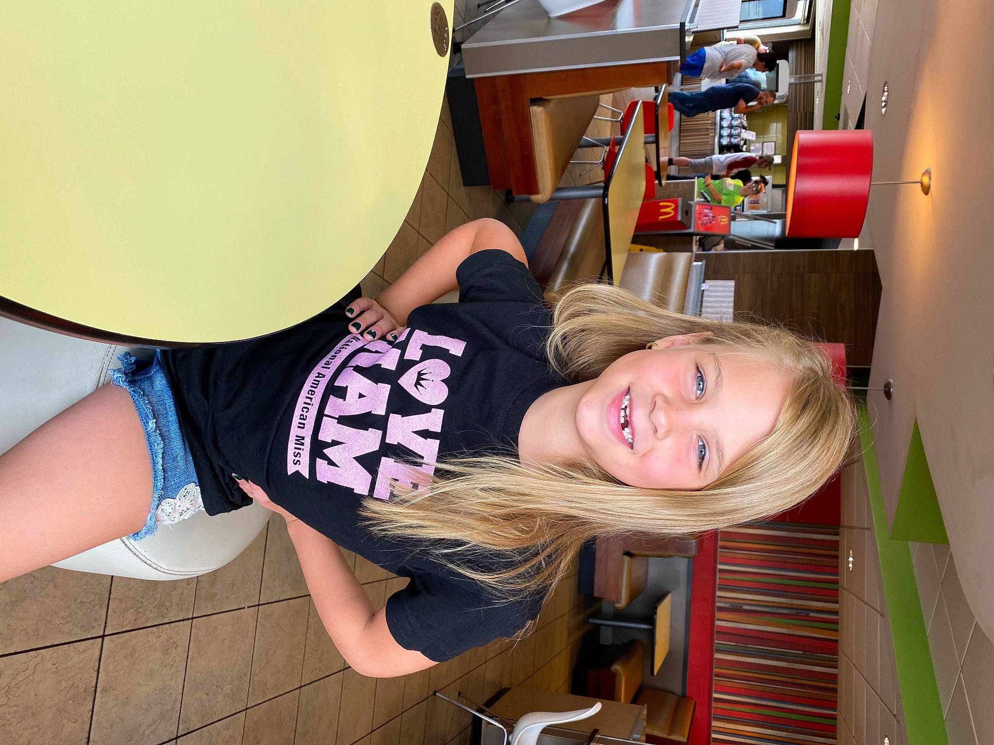 Rebecca joined the competition — help win amazing prizes! chair, elbow, fun, happy, human_leg, joint, joy, knee, leg, leisure, person, room, shelf, shelving, sleeve, smile, sportswear, street_fashion, t_shirt, thigh