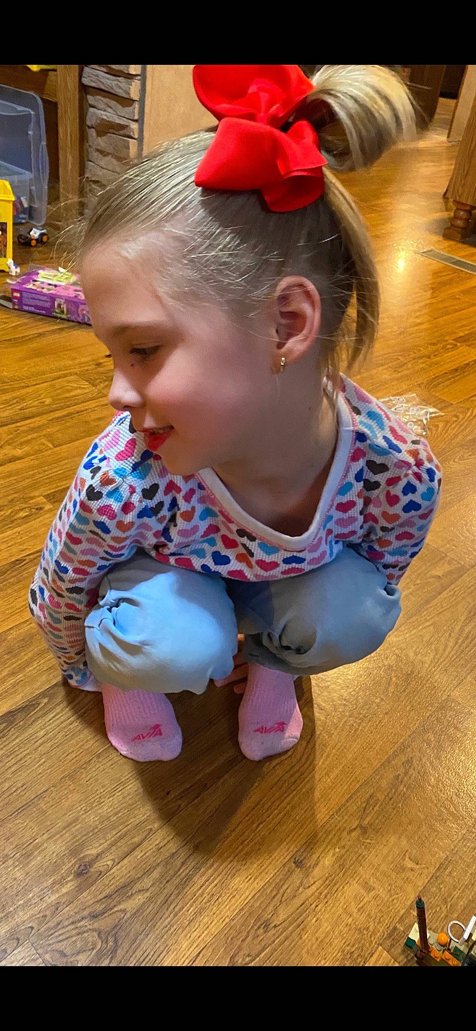 Rebecca is registered to the contest to win money with this photo: baby_toddler_clothing, cheek, child, fashion_accessory, floor, flooring, fun, happy, hardwood, headband, iris, joy, leisure, pattern, person, pink, sitting, skin, toddler, varnish