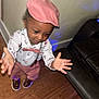 boy, brown_shoes, child, cute, fashion, happy, home, indoor, leather_couch, person, pink_bow_tie, pink_hat, pink_pants, portrait, reaching_out, smiling, suspenders, toddler, white_shirt, wood_floor
