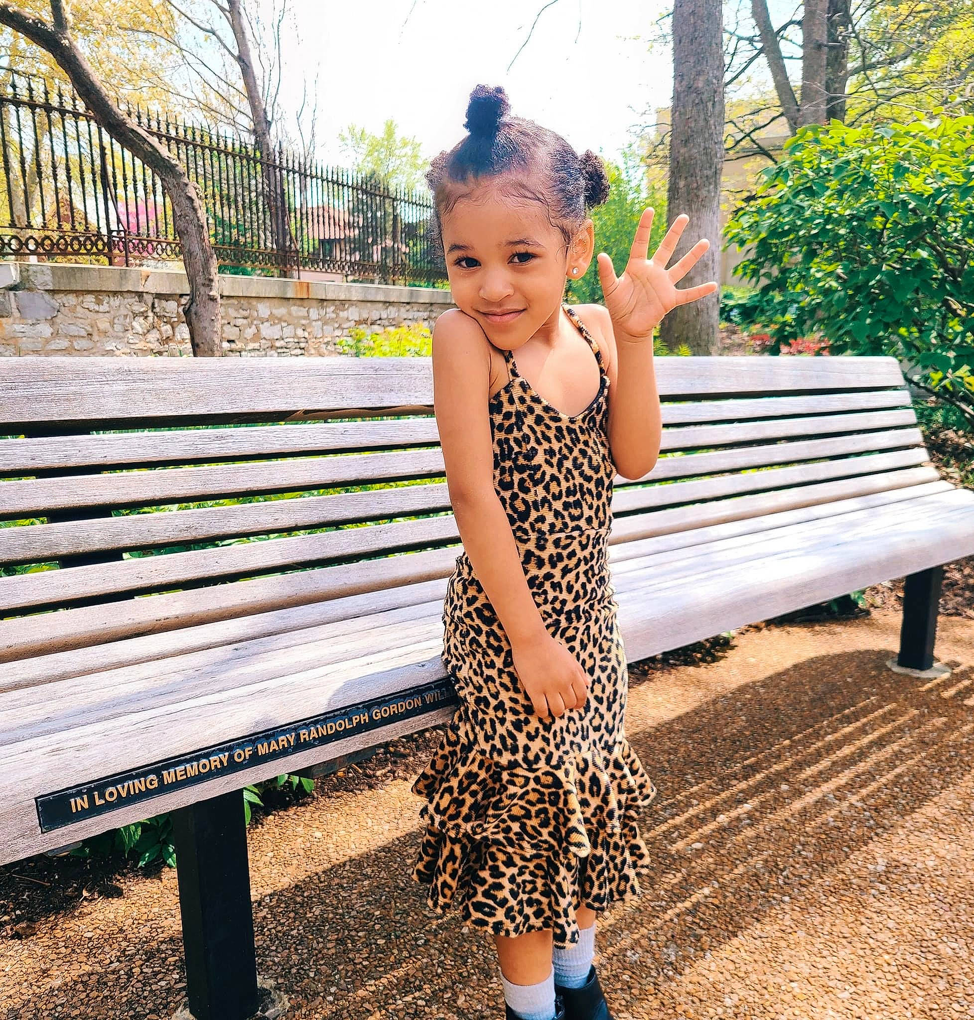 Jordyn is registered to the contest to win money with this photo: dress, grass, green, hairstyle, happy, human_body, joy, leaf, leg, leisure, mammal, outdoor_bench, people_in_nature, person, plant, smile, standing, sunlight, tree, vertebrate