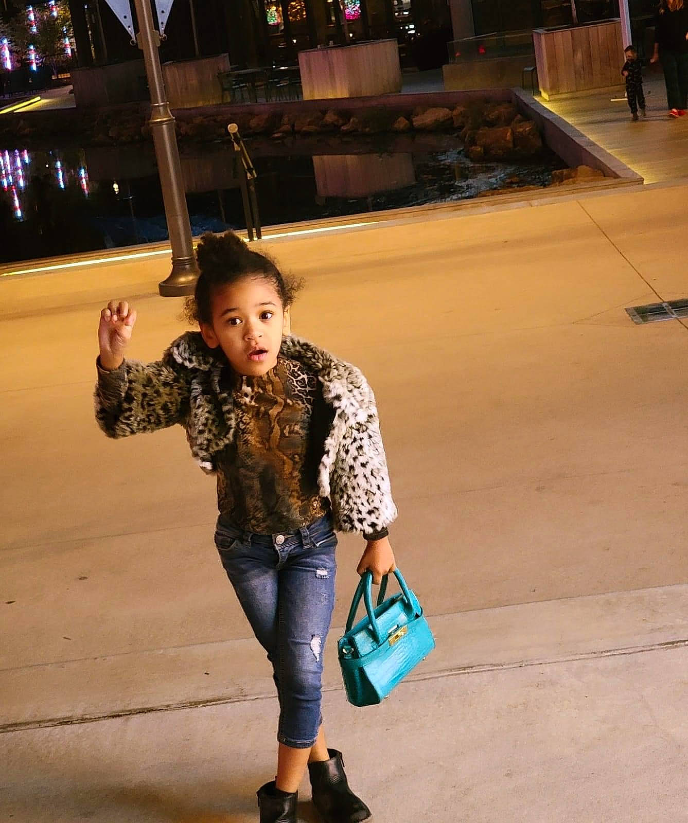 Jordyn is registered to the contest to win money with this photo: cool, denim, electric_blue, eyewear, fun, hairstyle, happy, human_leg, knee, leisure, long_hair, luggage_and_bags, person, plaid, sleeve, standing, textile, thigh, travel, trunk