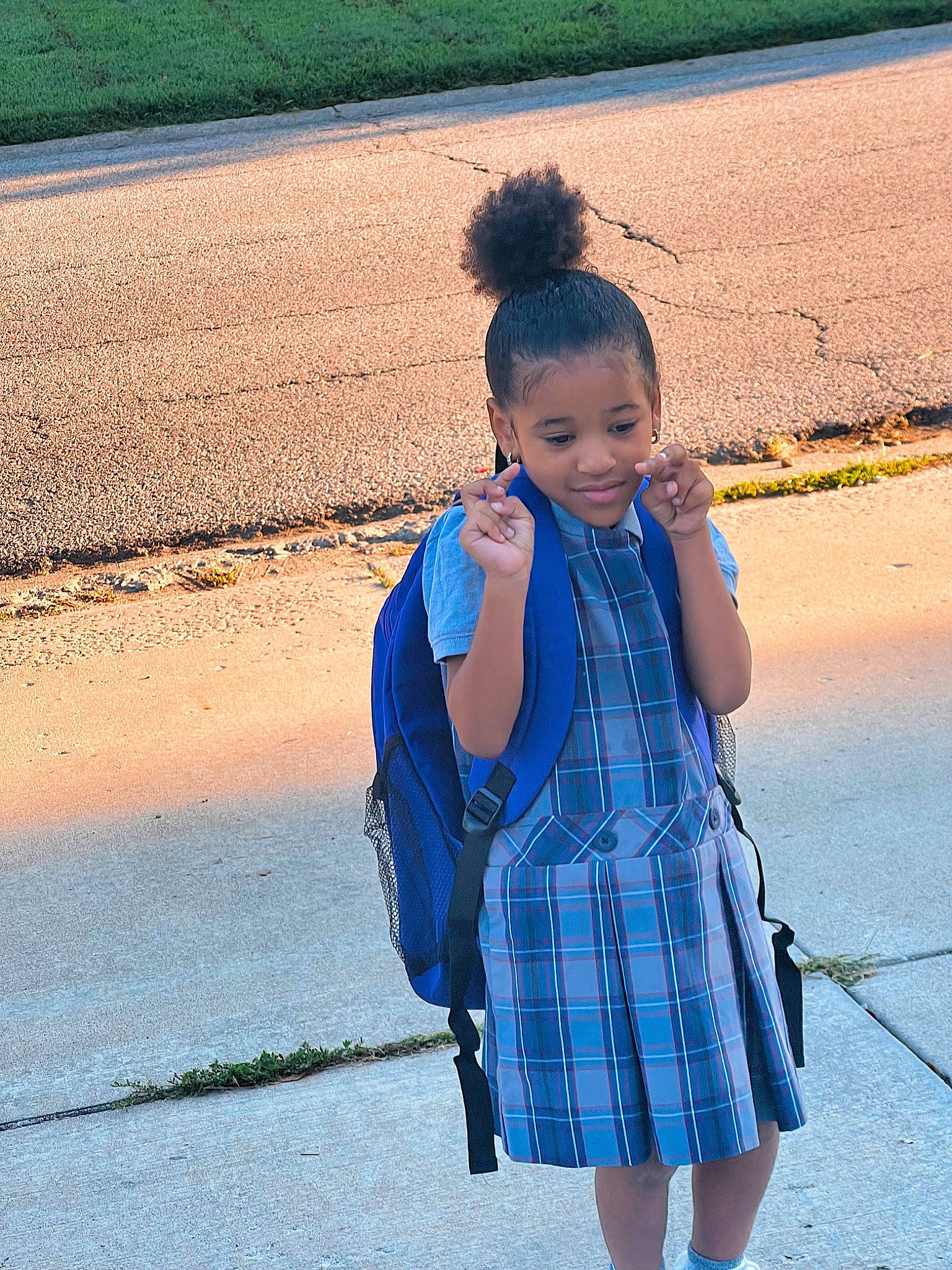Jordyn is registered to the contest to win money with this photo: azure, blue, daytime, electric_blue, fun, happy, joy, outerwear, people, people_in_nature, person, photograph, plaid, public_space, sleeve, smile, standing, summer, tartan, toddler