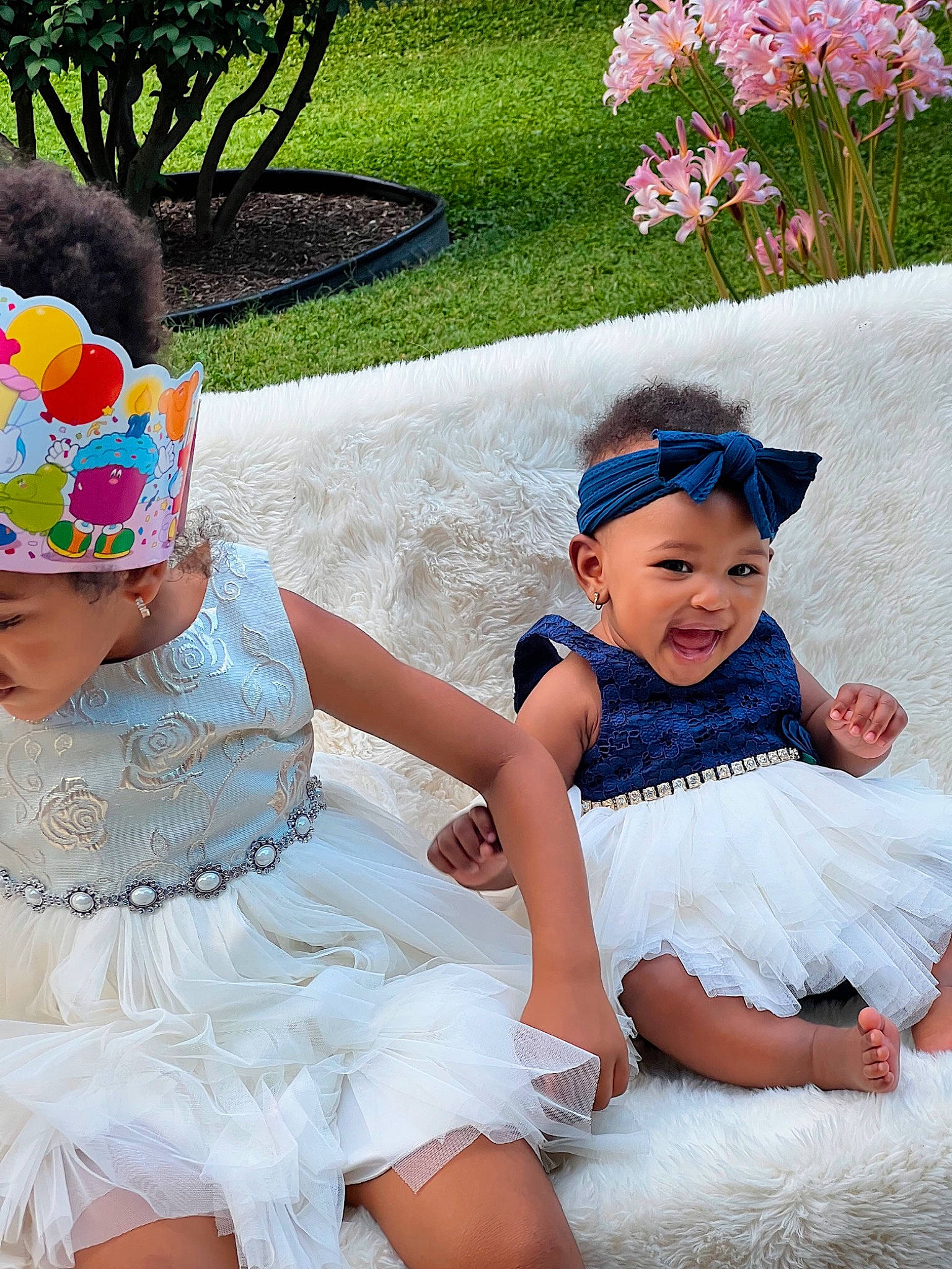 Sarah joined the competition — help win amazing prizes! baby, baby_toddler_clothing, blue, child, day_dress, dress, event, fun, grass, happy, headgear, headpiece, headwear, person, photograph, pink, plant, purple, summer, textile