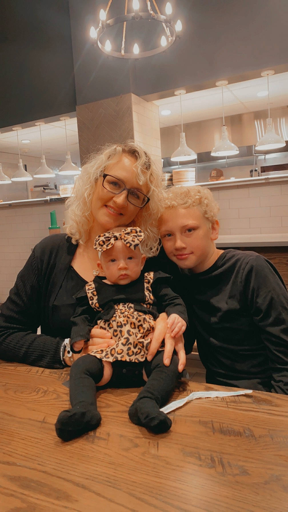 Victoria is registered to the contest to win money with this photo: arm, baby, child, conversation, event, eyewear, fashion_design, flooring, fun, hand, happy, headwear, interaction, jewellery, joy, leisure, person, room, sitting, t_shirt