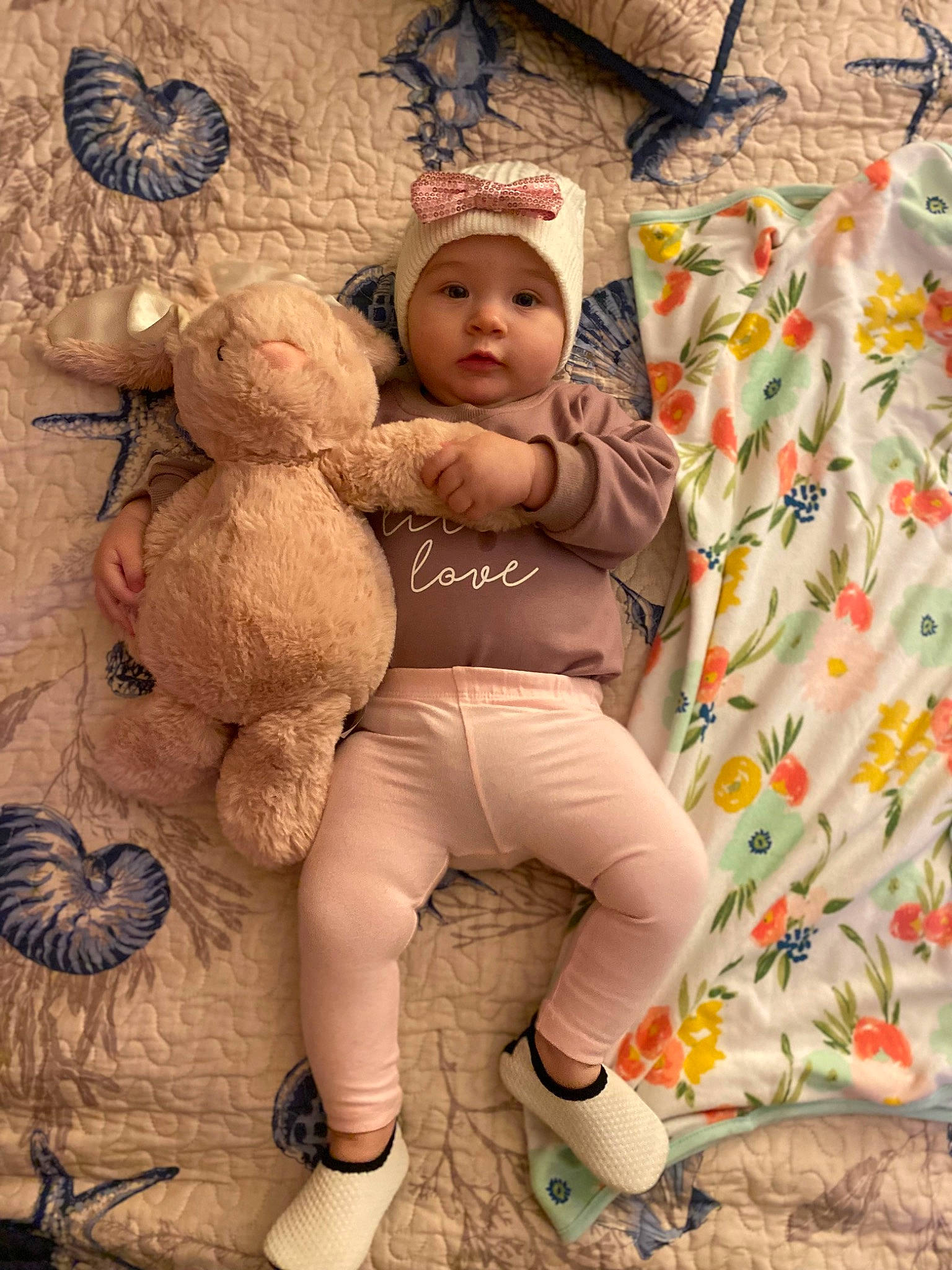 Victoria is registered to the contest to win money with this photo: baby, baby_toddler_clothing, child, doll, fawn, foot, fun, fur, happy, headwear, human_leg, linens, people_in_nature, person, plush, room, sitting, stuffed_toy, teddy_bear, thigh
