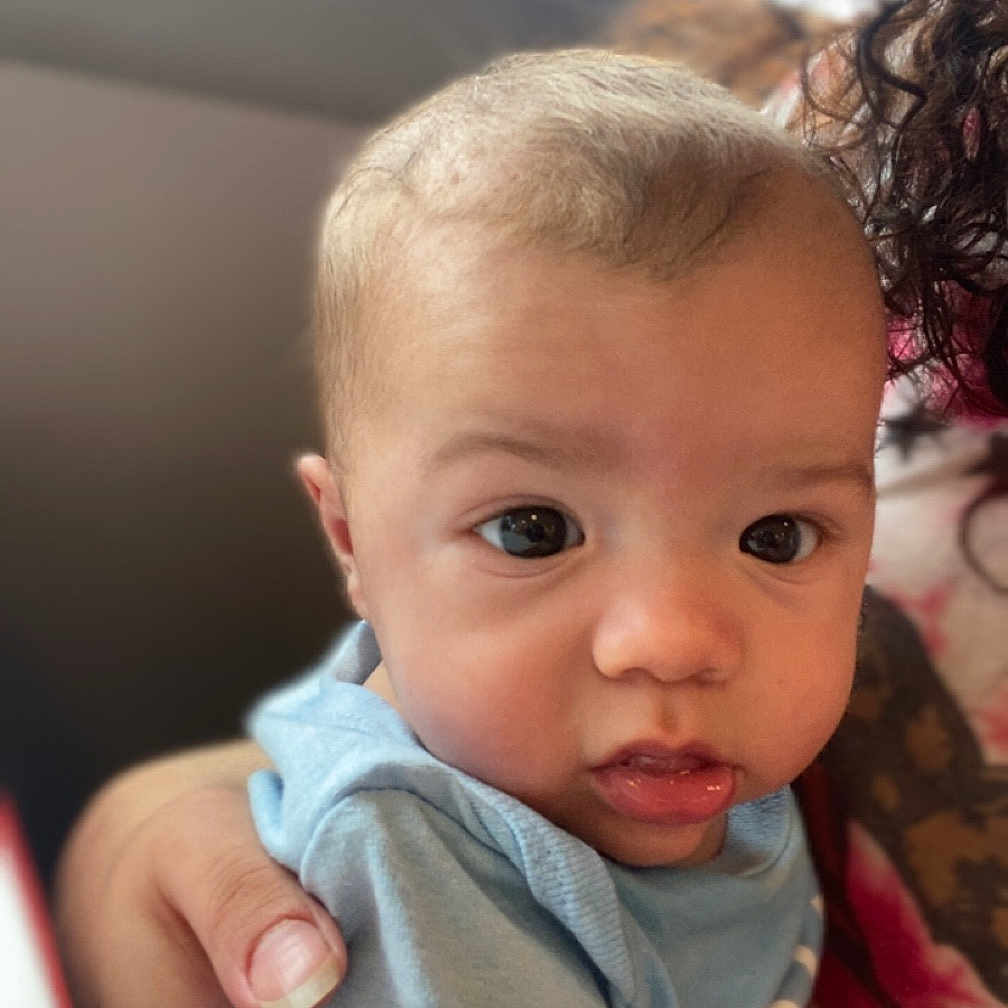 Wileyx is registered to the contest to win money with this photo: accessories, baby, bodypart, clothing, dress, earring, face, finger, hand, happy, head, jewelry, laughing, mouth, newborn, person, photography, portrait, smile, t_shirt