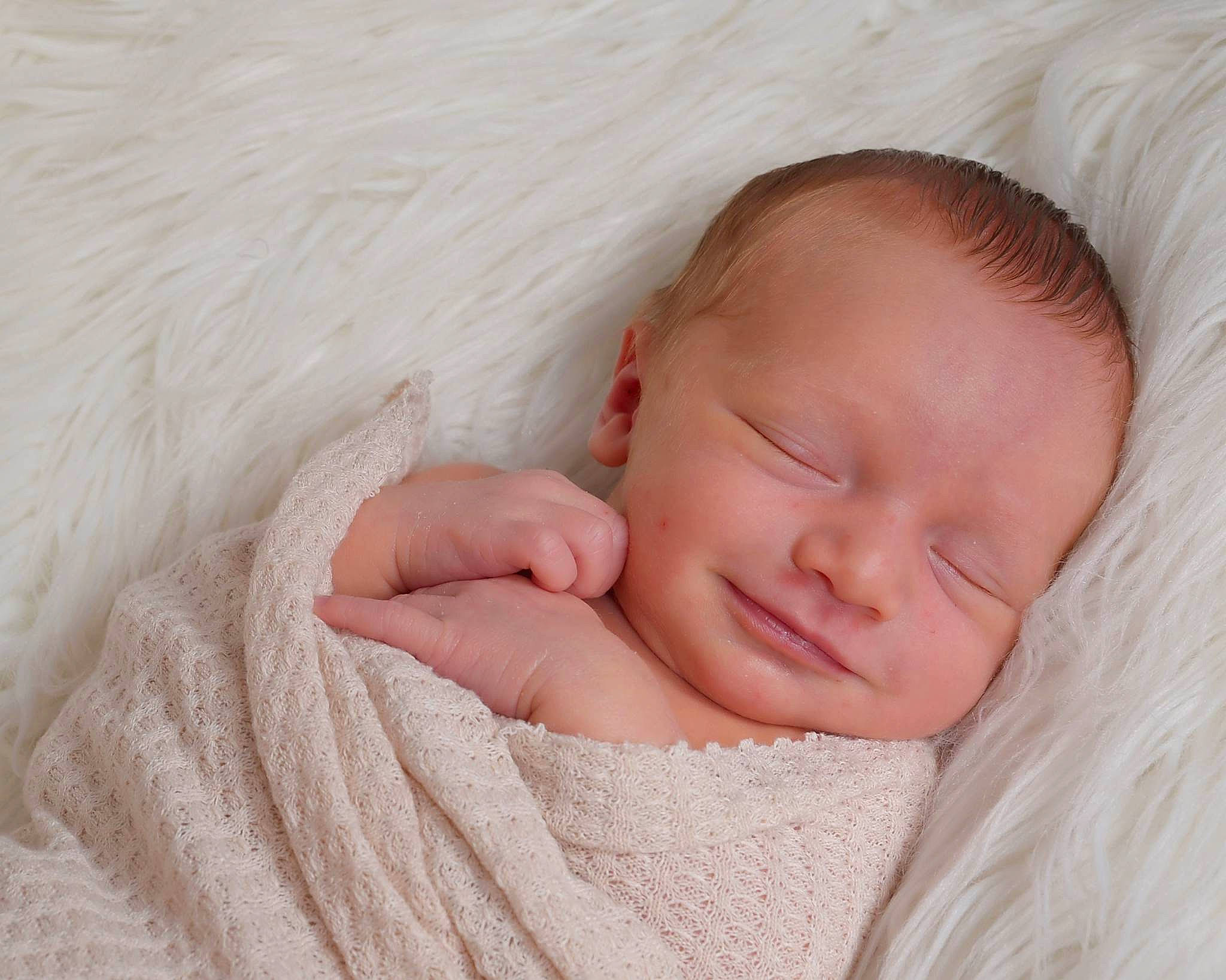Issac is registered to the contest to win money with this photo: baby, baby_sleeping, baby_toddler_clothing, bedding, bedtime, beige, cheek, child, comfort, fur, hair, linens, nap, pattern, peach, person, portrait_photography, skin, sleep, sleeve