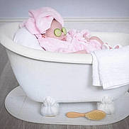 Khloe is registered to the contest to win money with this photo: baby, bathtub, cucumber_slices, pink_towel, towel_turban, bath_brush, white_towel, relaxation, spa, clawfoot_tub, flooring, baby_care, indoor, child, resting, cute, skin_care, funny, headwear, person