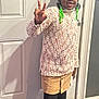 Alyssa is registered to the contest to win money with this photo: beads, braids, buttoned_skirt, casual_clothing, child, door, doorknob, girl, happy, indoor, knitwear, peace_sign, portrait, shadow, shoes, skirt, smile, standing, sweater, tights