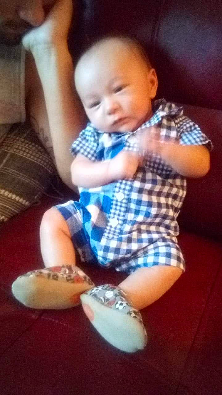 Dakotah joined the competition — help win amazing prizes! baby, cheek, child, ear, eating, food, footwear, head, leg, nose, pattern, person, play, shoe, sitting, skin, smile, toddler