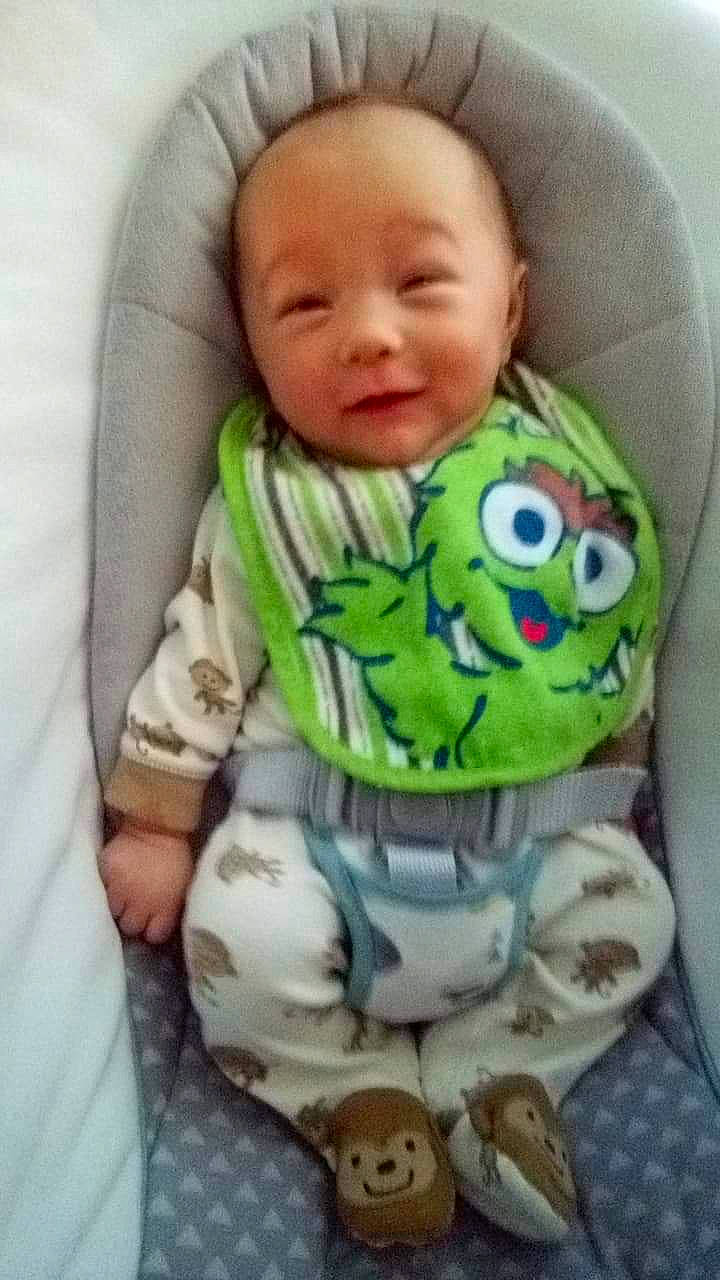 Dakotah is registered to the contest to win money with this photo: baby, baby_in_car_seat, baby_products, baby_sleeping, baby_toddler_clothing, cheek, child, head, nose, person, product, smile, toddler