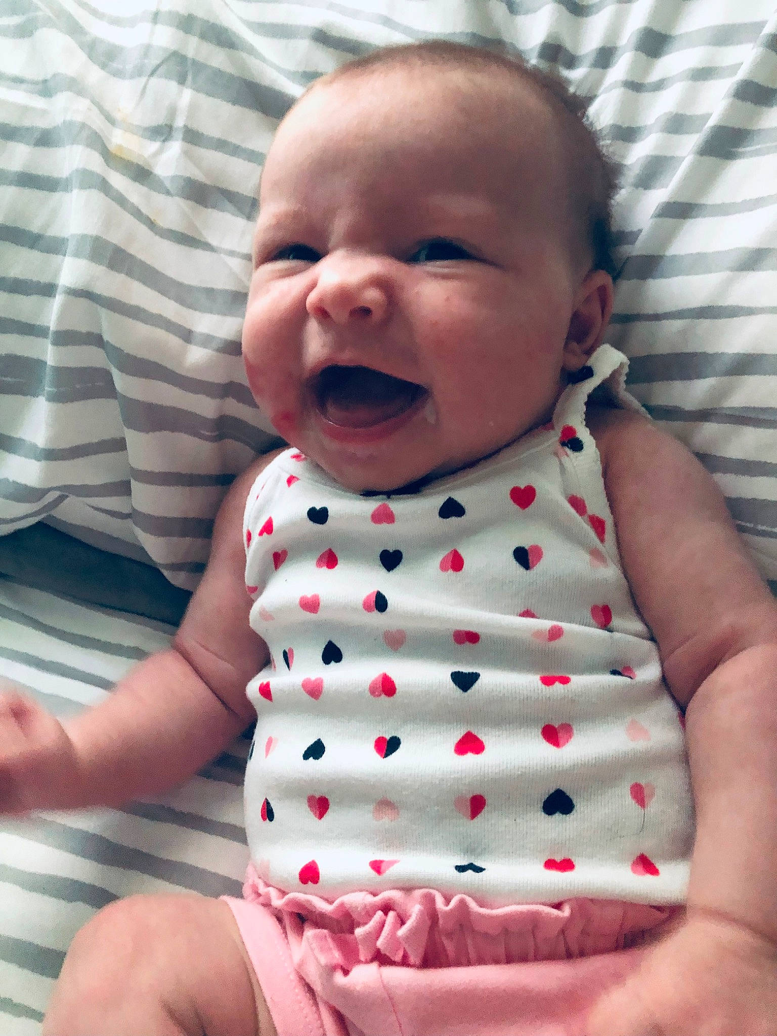 Delaney is registered to the contest to win money with this photo: baby, baby_toddler_clothing, beauty, cheek, child, comfort, facial_expression, finger, gesture, happy, lip, mouth, nose, pattern, person, pink, product, skin, sleeve, textile