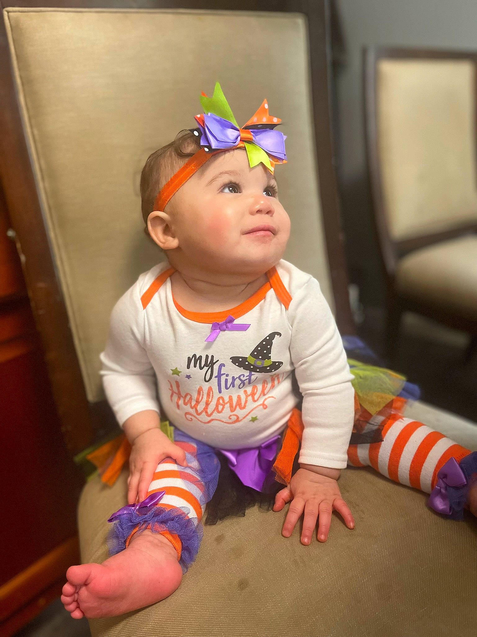 Genevieve joined the competition — help win amazing prizes! baby, baby_toddler_clothing, barefoot, cheek, child, door, eye, face, fashion_accessory, flooring, foot, fun, happy, head, headwear, person, personal_protective_equipment, room, sitting, sleeve