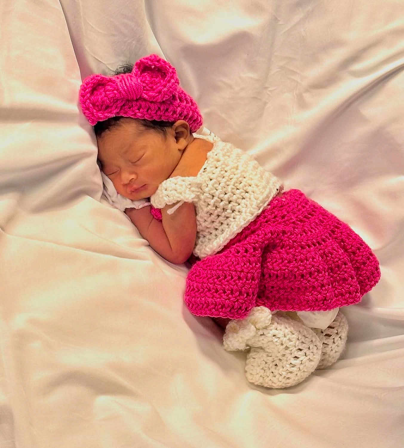 Kamani joined the competition — help win amazing prizes! newborn, baby, sleeping, crochet, pink, white, headband, bow, blanket, soft, cute, infant, resting, cozy, child, portrait, indoors, clothing, peaceful, toddler